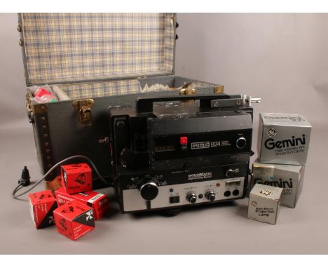 A Eumig 824 super 8 sonomatic projector in carry case, with collection of bulbs/lamps.  