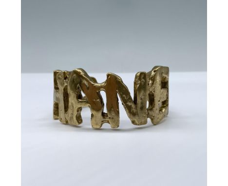 This hand-cast chunky bronze bracelet is a stunning fusion of understated elegance and bold fashion. Featuring the iconic Cha