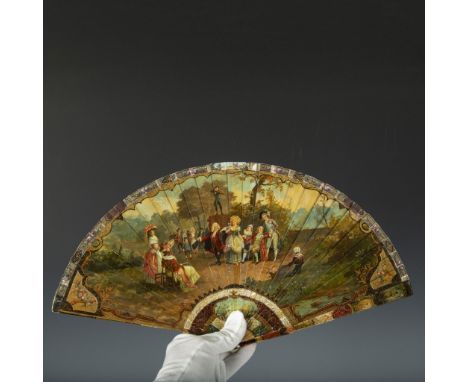 Exquisite hand-painted fan featuring an intricately gilt handle. The painting beautifully depicts a group of people in period