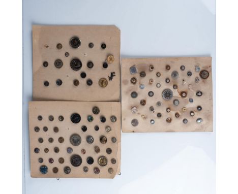 3 cards of 100 buttons in various sizes, materials, and themes. Themes includes an opalescent floral, an architectural and la