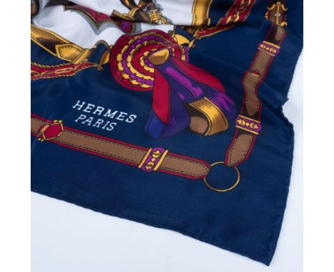 French silk scarf with rich blue, purple, brown, burgundy, yellow and gray tones. Features a horse riding motif throughout th