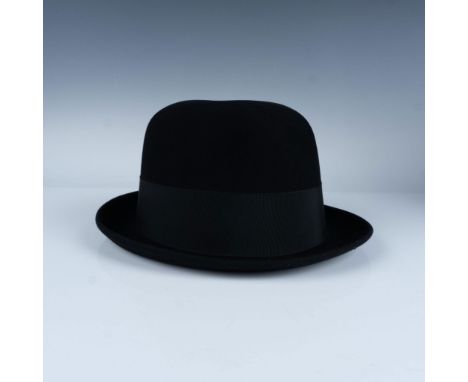 Soft wool felt material with black ribbon band. Leather stitched interior brim with satin lining. Blue hat box included with 