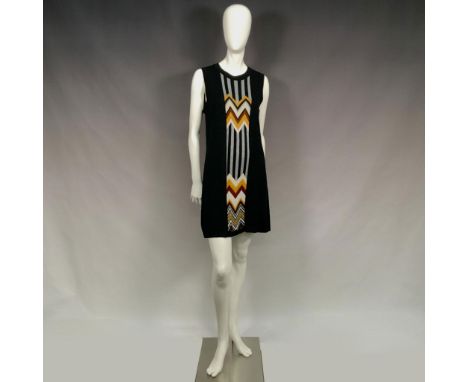 Made for Target Stories Limited Edition Collection. A black dress with a boat neckline, and Chevron stripe pattern at the fro