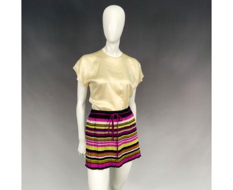 Made for Target Stories Limited Edition Collection. A short ruffled skirt with shades of pink and green horizontal bands. A s