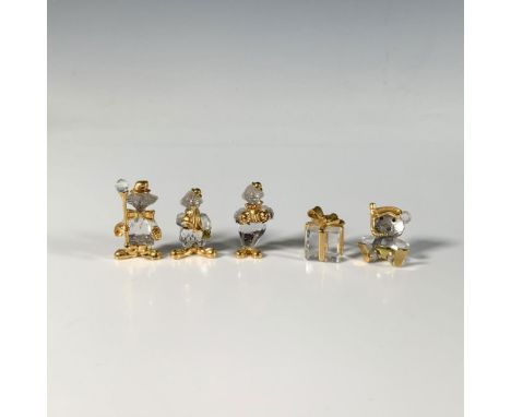 This charming set includes four brooches: three playful clowns, and a snorkeling bear, accompanied by a present-shaped figure