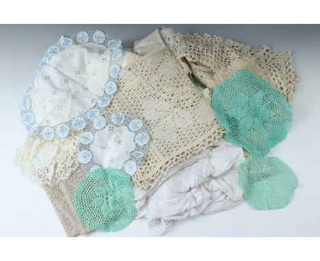 A quantity of vintage doilies etc 