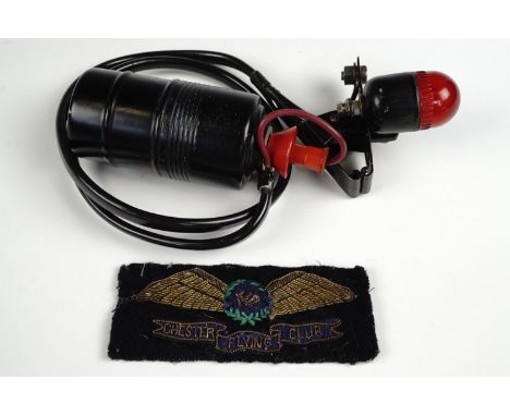 A mid 20th Century Chester Flying Club embroidered wings badge together with a life jacket lamp