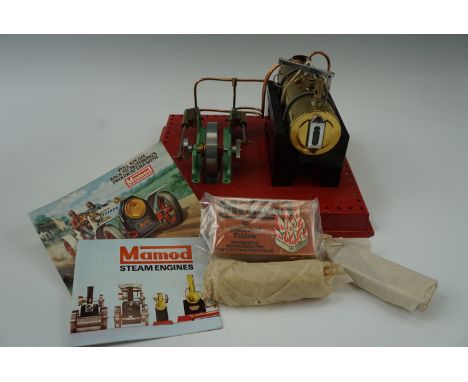 A Mamod new-old-stock twin cylinder superheated steam engine with accessories, in original box