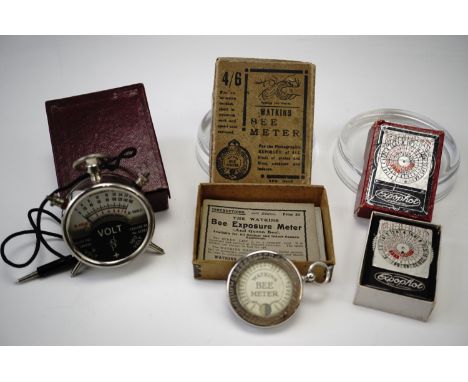 A Watkins "Bee Exposure meter - for all indoor and outdoor cameras", a Expophot light meter and volt meter