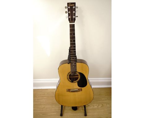 An Encore model number EA255 acoustic guitar with soft case and stand