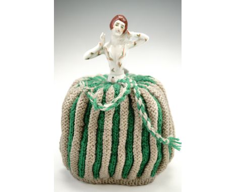 A vintage ceramic and fabric "crinoline dress" figural tea-cosy, 25 cm