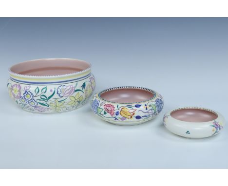 Three Poole hand-painted pots, largest diameter 19 cm