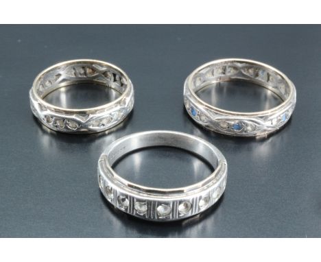 Three various vintage yellow and white metal bands