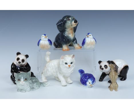 A Hummel kitten, a Sylvac puppy, two pandas, three bird figurines etc