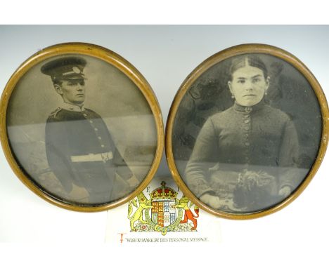 A late 19th / early 20th Century framed photographic portrait of a Border Regiment soldier in full dress uniform, together wi