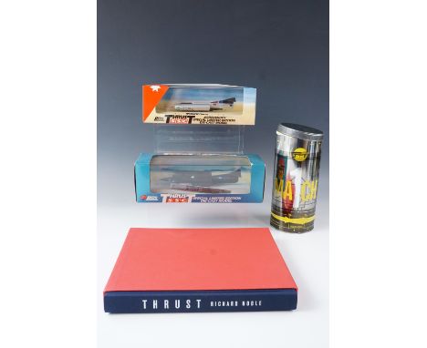 Two boxed Thrust "SuperSonic" die-cast model cars, a Thrust book by Richard Noble and an original Thrust glass