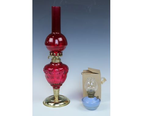 A ruby and gilt oil lamp (a/f), together with a boxed miniature oil lamp, 43 cm and 13 cm respectively
