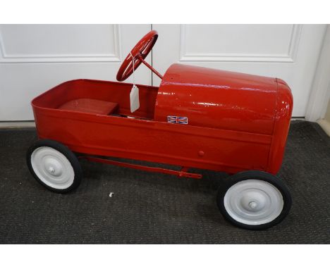 A vintage toy pedal car