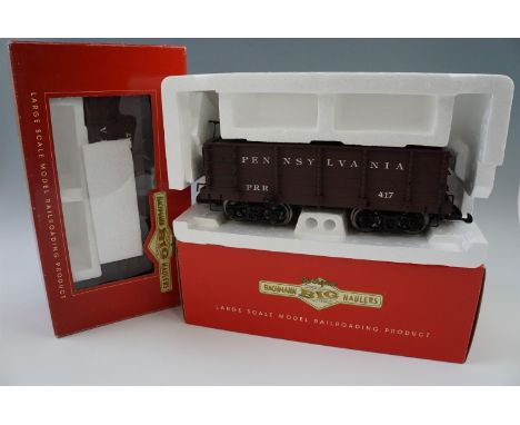 Two Bachmann "6" model railway wood ore cars