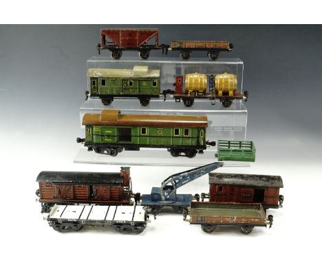 A selection of Marklin tinplate O gauge model railway rolling stock, 1930s comprising 18440 luggage box car with internal lig