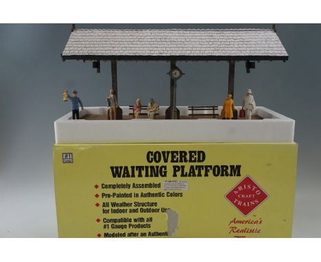 An Aristocraft covered waiting platform for garden model railway