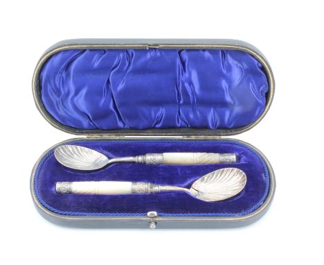 A pair of late Victorian silver spoons having mother of pearl handles and stylized honeysuckle bowls, Sheffield, 1900