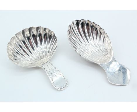 A Georgian silver caddy spoon, having a shell-form bowl and bright cut handle, together with a similar late 20th century silv