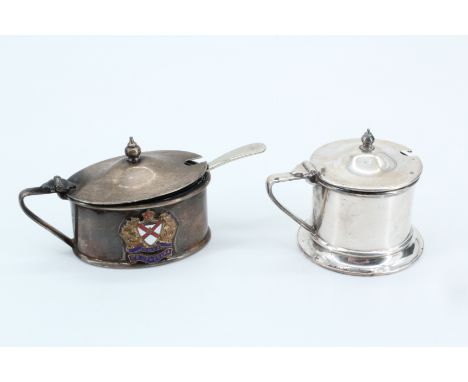 A early 20th Century silver condiment pot together with associated spoon and a enamel crested condiment pot