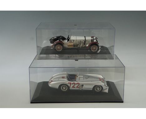 Two CMC die-cast 1:18 scale model cars in display cases; Mercedes-Benz 300 SLR 1955 and Mercedes-Benz SSKL 1931