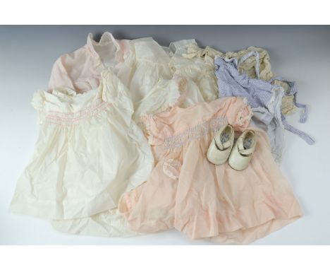 A quantity of vintage infants' clothes etc, together with a pair of Baby Deer infant's shoes