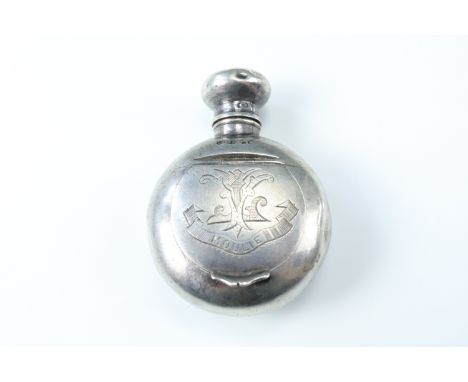 A Victorian lady's silver combined scent bottle and compact, being of flask form having a hinged top enclosing a glass stoppe