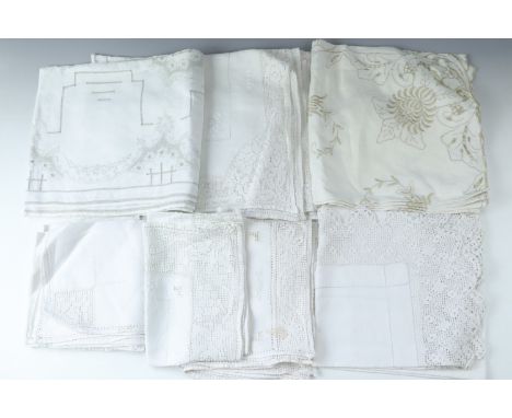 A quantity of vintage table cloths etc