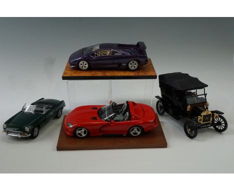 A boxed MGB MK1 1:18 scale die-cast car, a Ford die-cast car, a Dodge Viper with stand and a Lamborghini with stand