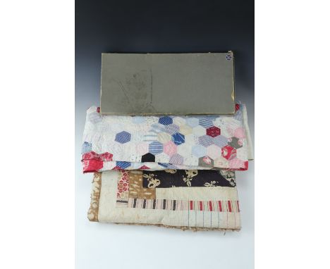 Two early 20th Century patchwork quilts, hand stitched and lined, (a/f), 2.1 m x 1.9 m and 2.45 m x 1.9 m together with a box