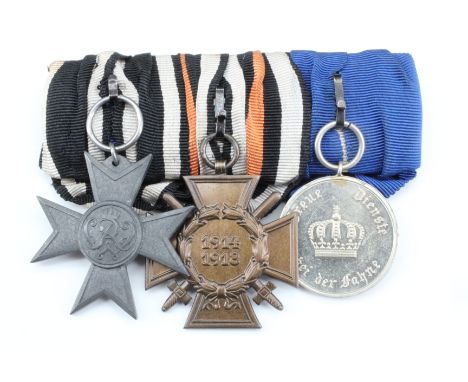 A court mounted group of Imperial German service medals including a Merit Cross for War Aid, Honour Cross and Bavarian faithf