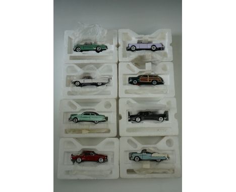 Twelve Franklin Mint die-cast model cars