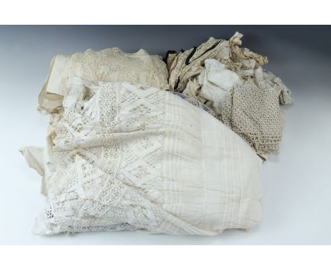 A quantity of vintage tablecloths, doilies etc