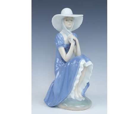 A Nao figurine, girl with bonnet, 28 cm