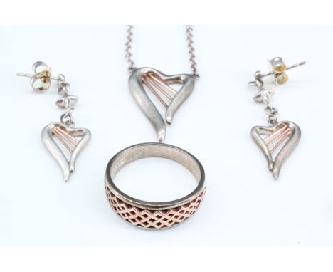 A suite of contemporary Welsh Clogau silver and yellow metal jewellery comprising a heart / harp pendant necklace, conforming