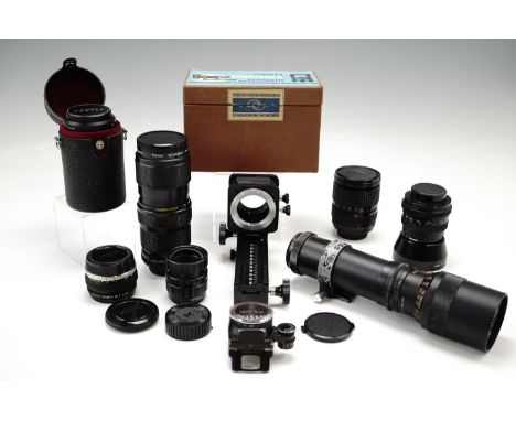 Various camera lenses including RMC Tokine 28-70 mm 1:3.5-4.5, Prinzgalaxy 1:56-6 EZ 300 mm, Asahi 1:3-5/135, a Pentax light 