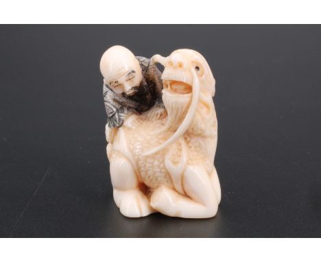 A Japanese ivory netsuke of Gentoku riding a horse into the Dankai river, 4 cm