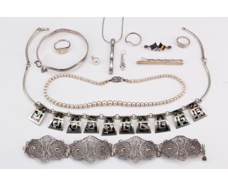 A selection of silver jewellery, comprising filigree bracelet, a Mexican necklace, a silver waney edge bracelet, cultured pea
