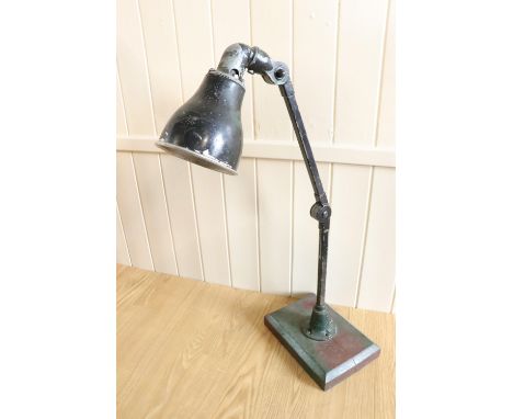A vintage enamelled workshop adjustable lamp, approximately 75 cm high when upright