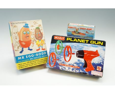 Three vintage children's toys; Mr Egg-Bodd and his friend Mr Potato-Head, Porky's Speed Boat and Planet Gun all in original c