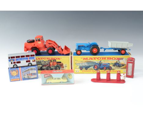 A boxed Matchbox Hatra Tractor Shovel K3, a boxed Fordson tractor and trailer, Minix car, Matchbox Jubilee bus, a Lesney Esso