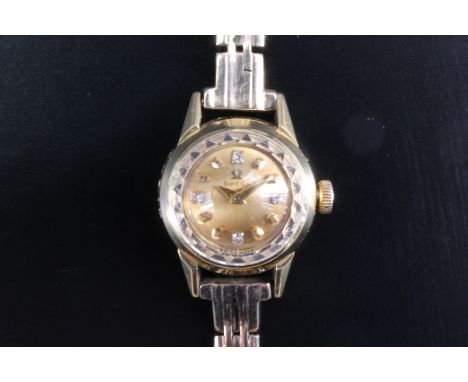 A lady's Omega 18 ct yellow metal dress or cocktail watch, having a calibre 483 manual wind movement and gilt circular face s