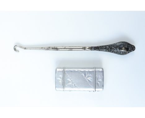 An early 20th Century aluminium equestrian-themed Vesta case together with a silver-handled button hook