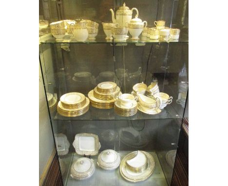 WEDGWOOD 'GOLD FLORENTINE' DINNER SERVICE, nine plate setting including tea and coffee wares, tureens and serving plates. (11