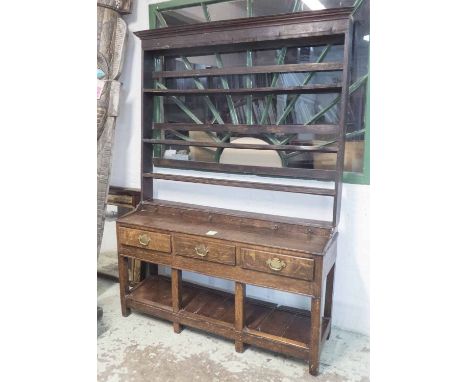 WELSH DRESSER, George III oak the open plate rack with dummy spice drawers over three real drawers and potboard below, 43cm x