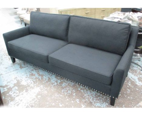 SOFA, two seater, in charcoal fabric, studded on square supports, 215cm L. 